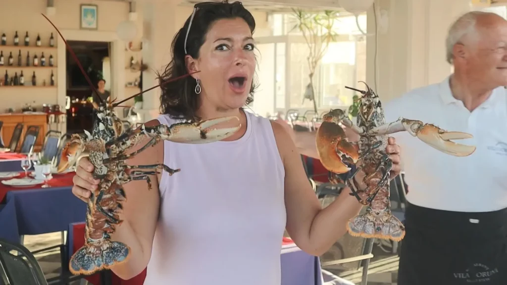 Angela holding fresh lobsters in Mali Ston