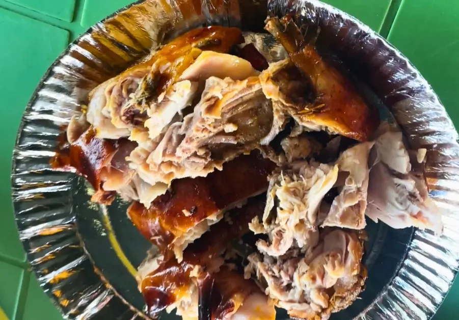 Chopped roasted rabbit meat served in foil at Hops Grill House.