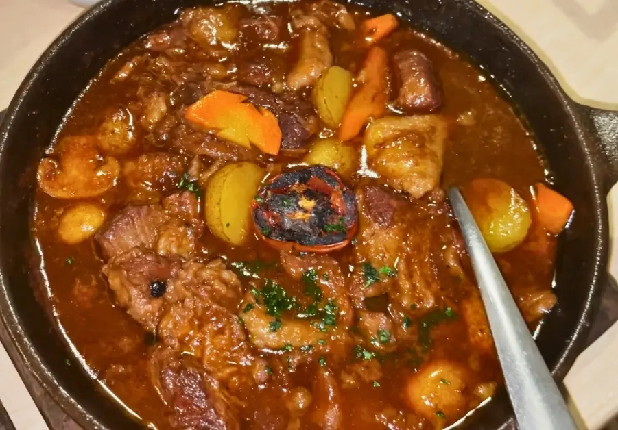 Kalderobo beef stew served in a cast iron skillet at Rekado in Davao.