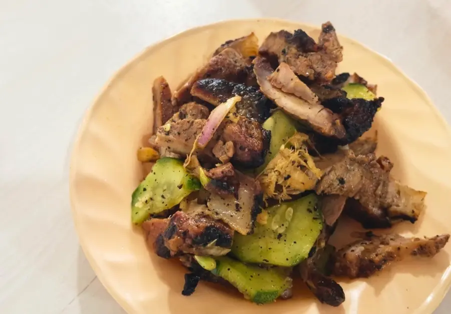 Sinuglaw dish with grilled pork and raw fish mixed with cucumber and onions