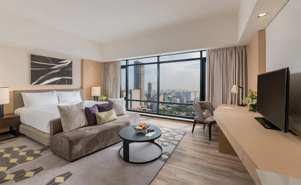 Premier room at Seda Vertis North in Quezon City with skyline views and modern furnishings