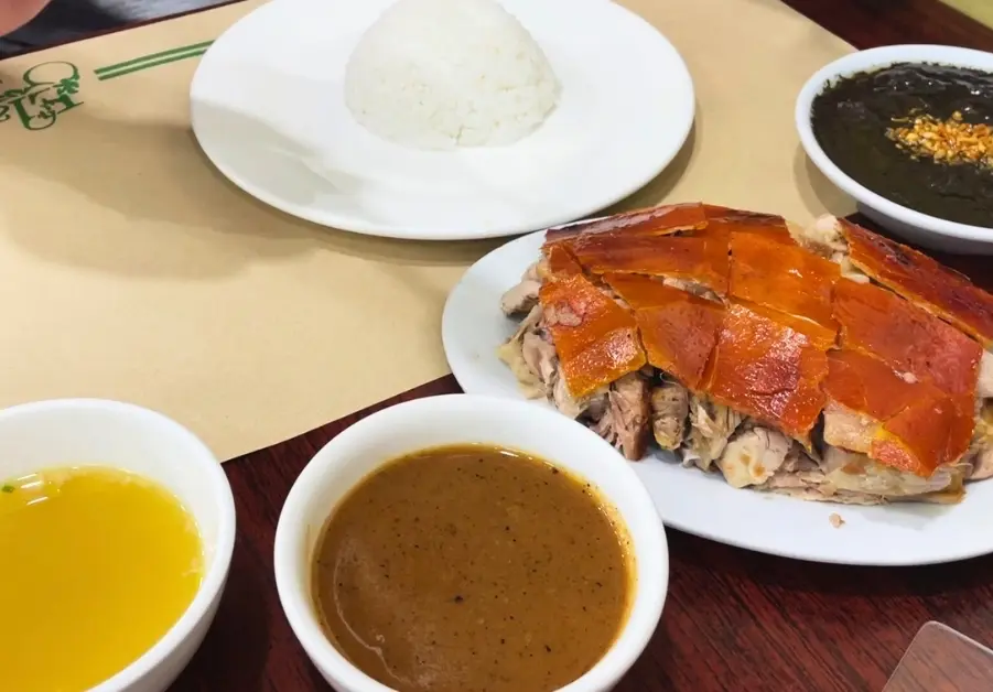 Where to Eat in Quezon City: 11 Must-Try Locations Lechon plate with dinuguan and dipping sauces from Elar’s Lechon in QC.