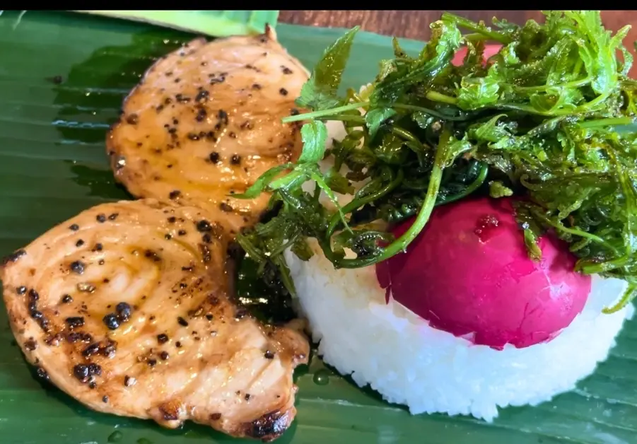 Where to Eat in Quezon City: 11 Must-Try Locations Blue marlin rice meal served kamayan-style on banana leaves at Gubat in Quezon City.