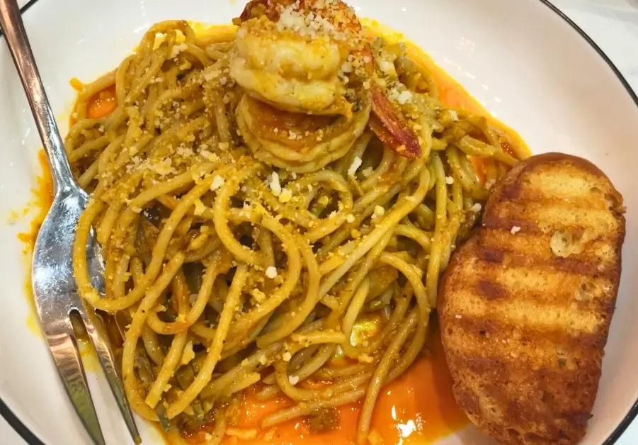Where to Eat in Quezon City: 11 Must-Try Locations Aligue pasta with shrimp and garlic toast from Hungry Neighbors restaurant in QC.