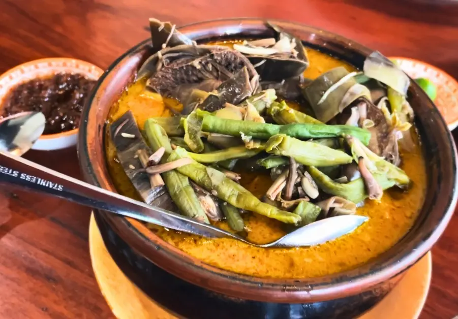 Where to Eat in Quezon City: 11 Must-Try Locations Kare-kare with vegetables and bagoong from Little Quiapo in Quezon City.