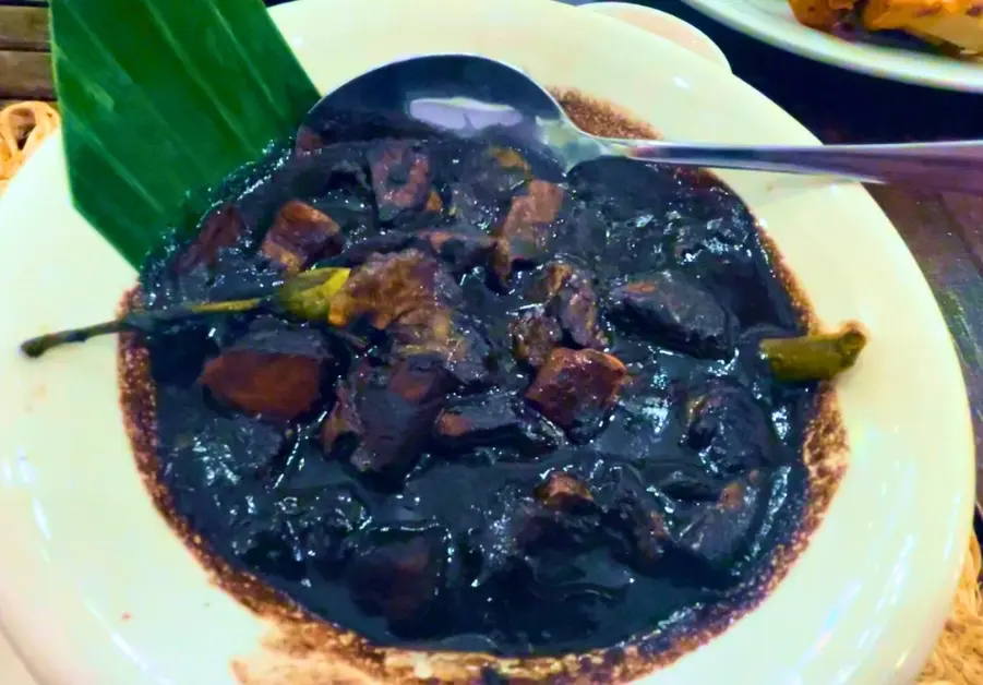 Dinuguan with puto served at Provenciano Restaurant in Quezon City