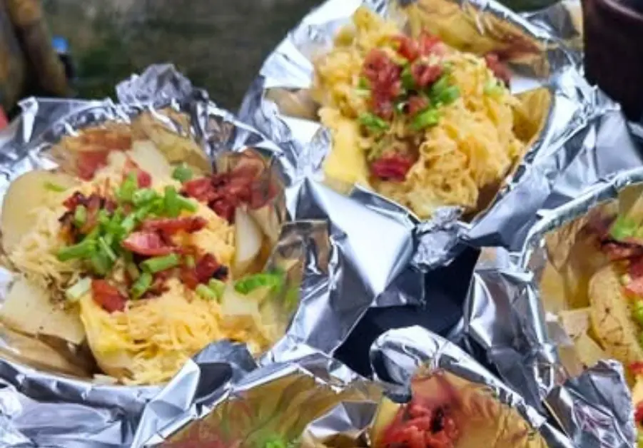 Cheesy grilled potatoes served hot off the grill at a local Quezon City street food spot.