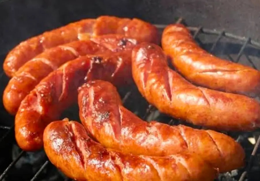 Hungarian sausages grilling over high heat at Basta Kulot.