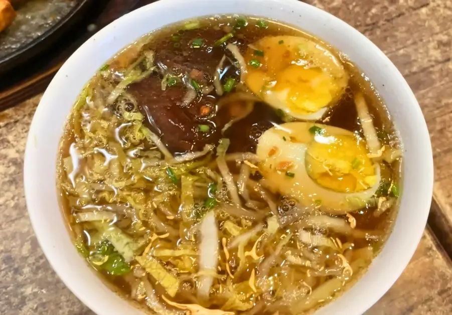 Cheap Eats in Quezon City: Affordable Restaurants and Meals Bowl of beef pares mami with hard-boiled egg from one of the Original Pares Mami House locations in La Loma