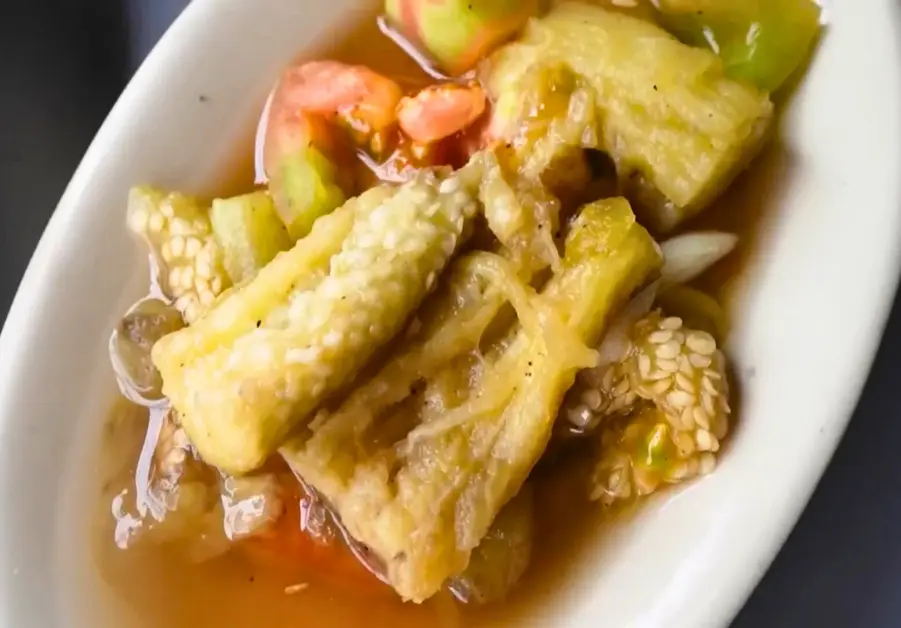 Morning Sun Eatery: The Carinderia You Didn’t Know You Needed Stewed eggplant slices with vinegar and tomato served in a shallow oval dish