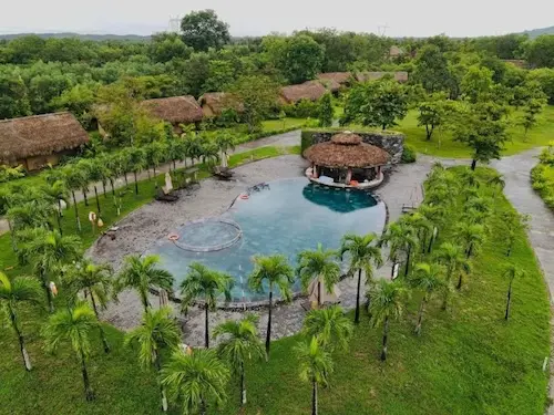 Luxury poolside loungers at Alba Wellness Resort in Hue