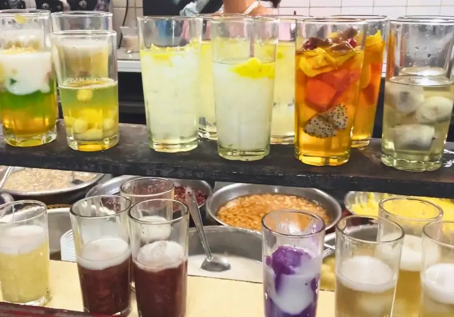 Glasses of colorful Vietnamese chè desserts at Chè Hẻm Hue