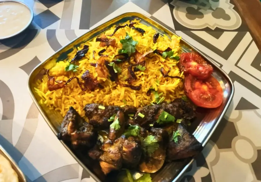 Khandan Kapitolyo: Unbeatable Pakistani Food in Pasig Pakistani biryani with freshly grilled kebabs, fried onions and spice mix at Khandan Kapitolyo