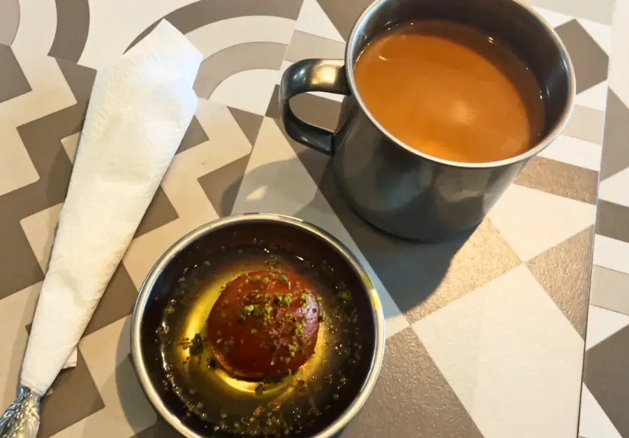 Khandan Kapitolyo: Unbeatable Pakistani Food in Pasig Gulab jamun topped with pistachios served with masala chai at a Pasig restaurant