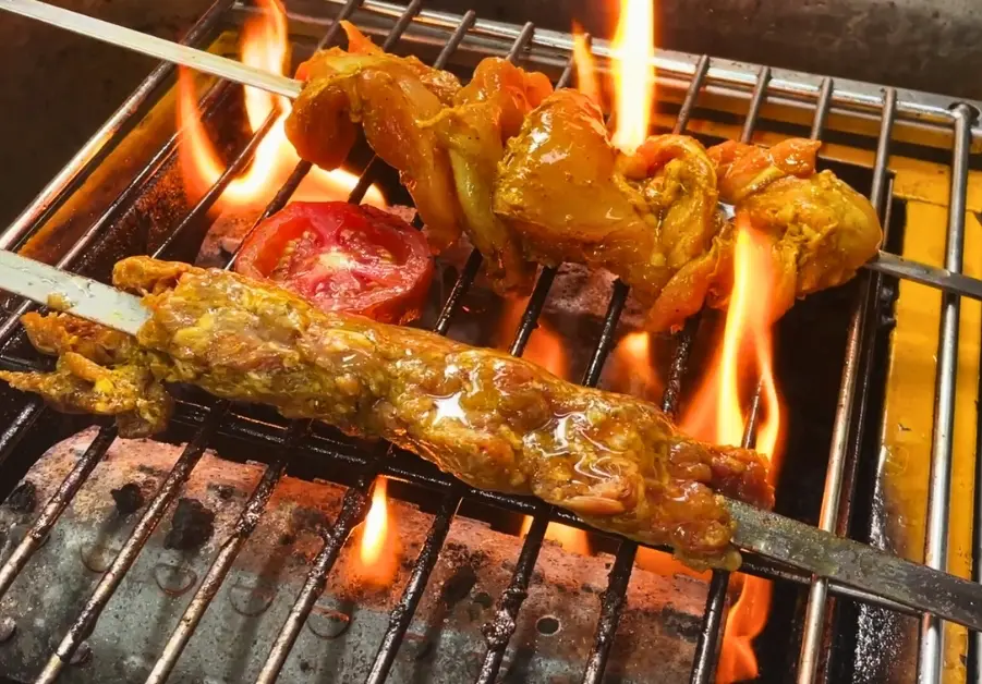 Khandan Kapitolyo: Unbeatable Pakistani Food in Pasig Pakistani Kebabs grilling over open flames at Khandan Kapitolyo