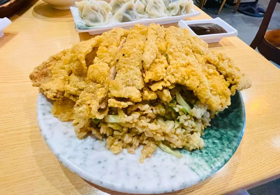 Uniku: Greenfield’s Best Taiwanese Food The enormous fried chicken filet served over seasoned fried-rice at Uniku.